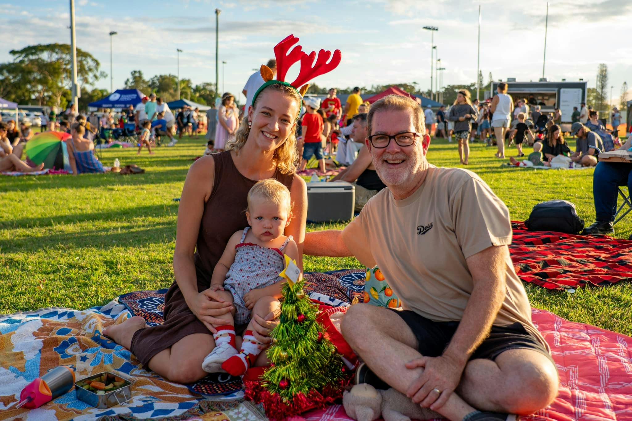 A family celebrating Christmas at Riverside Carols